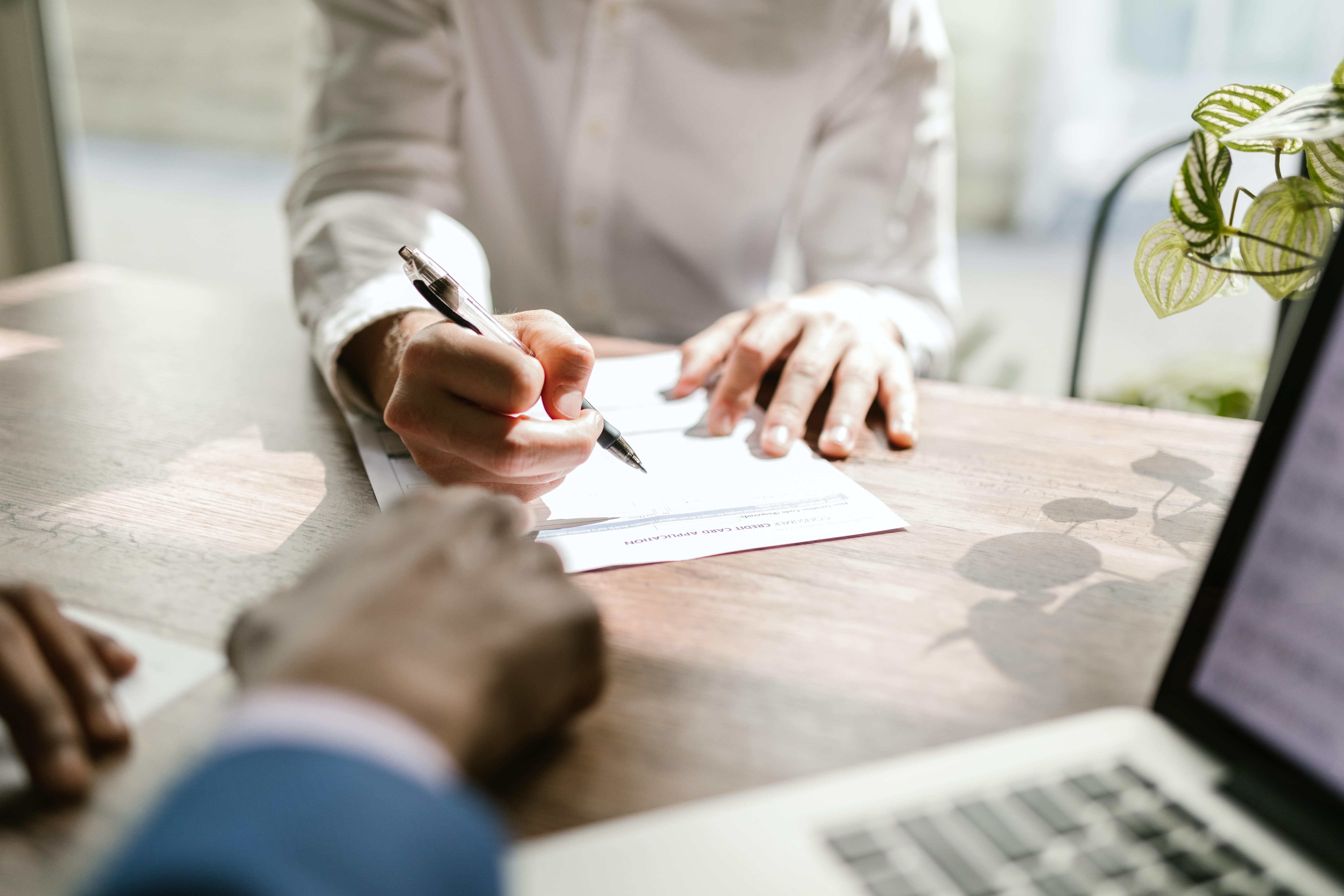 woman signing a contract